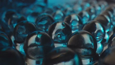 Water flows over transparent spheres Video stock 165036147