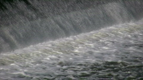 Water flows over a weir, creating small waterfall (High Definition) Stock Footage 365140
