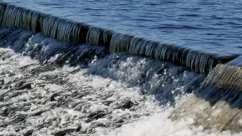 Water flows over weir Stock Footage 75303286