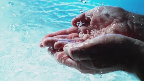 Water flows into palms of the hand Stock Footage 83842131