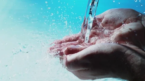 Water flows into palms of the hand Stock Footage 83842786