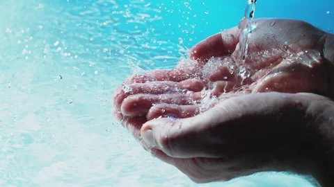 Water flows into palms of the hand Stock Footage 83843699
