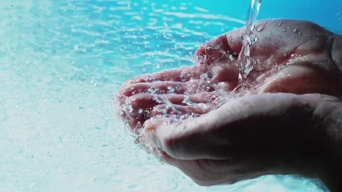 Water flows into palms of the hand Stock Footage 83847645