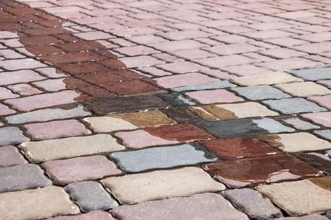 Water flows on paving slabs close up Stock Photos