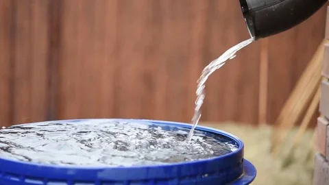 Water flows from a pipe in the rain Stock Footage 73833264