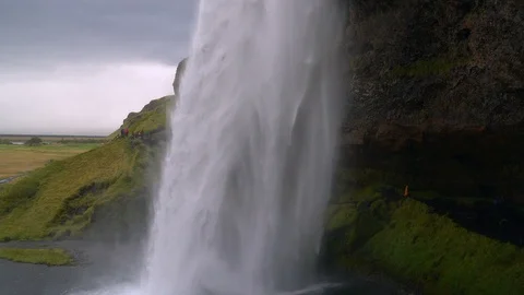 Water flows in a powerful stream down the waterfall. 스톡 동영상 122856848