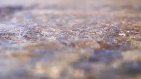 Water flows quickly in the river near the shore.	 Stock Footage 127526241