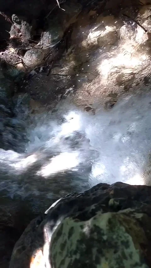 Water flows rapidly over the rocks Stock Footage 331106375