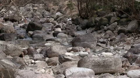 Water flows on a river bed Stock Footage 87564818