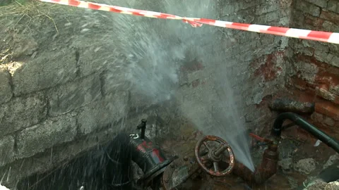 Water flows from a rusty water pipe. Water accident Stock Footage 134823006