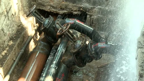 Water flows from a rusty water pipe. Water accident Stock Footage 134827459
