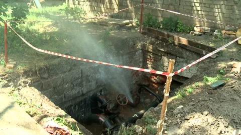 Water flows from a rusty water pipe. Water accident Stock Footage 134831004