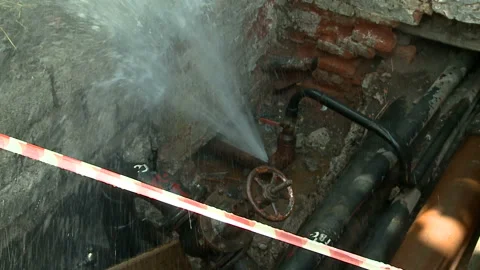 Water flows from a rusty water pipe. Water accident Stock Footage 134927923