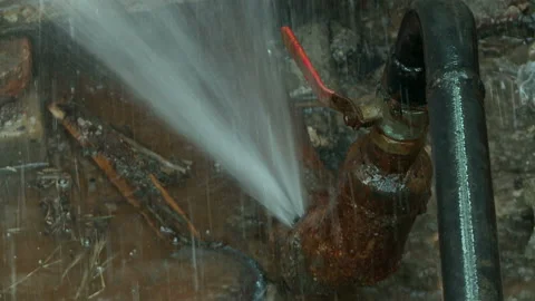 Water flows from a rusty water pipe. Water accident Stock Footage 134931208