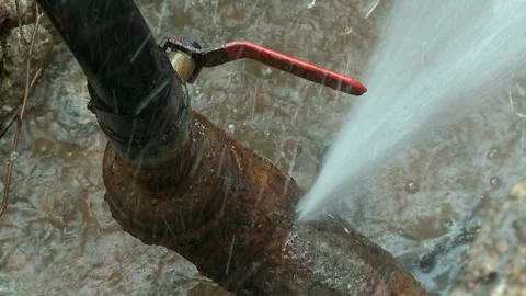 Water flows from a rusty water pipe. Water accident Stock Footage 134932253