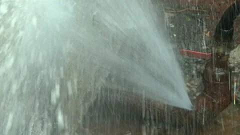 Water flows from a rusty water pipe. Water accident Stock Footage 134934596