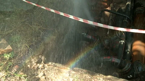 Water flows from a rusty water pipe. Water accident Stock Footage 134936519