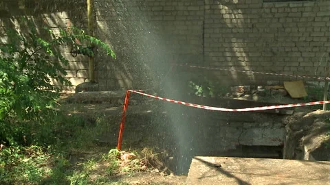 Water flows from a rusty water pipe. Water accident Stock Footage 136651784