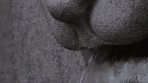 Water flows from the sculpture Stock Footage 100243189