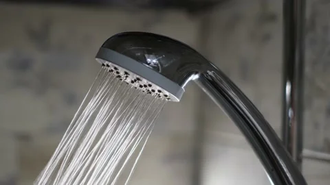 Water flows from the shower in the bathroom, closeup Video stock 236481680