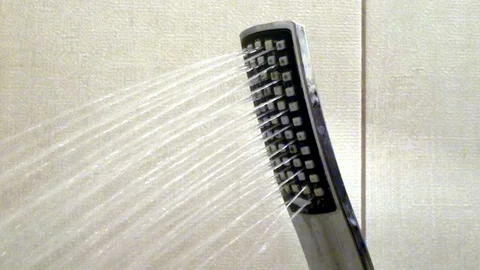 Water flows from the shower head Stock Footage 87587372