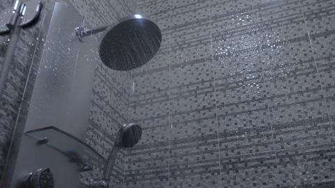 Water flows from the shower. The stream of water flows from the shower head Stock Footage 120295014