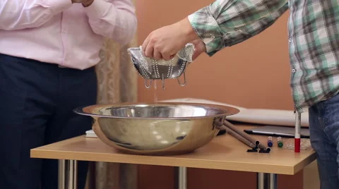 Water flows into the sieve Stock Footage 67354513