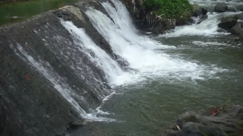 Water flows in a small dam 스톡 동영상 300323092