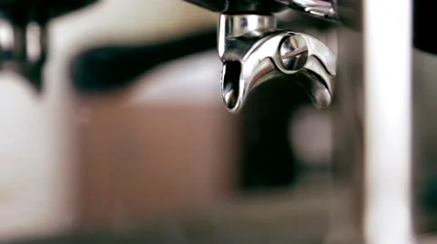 Water flows from the tap and coffee machine Stock Footage 66453890