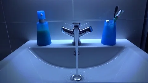 Water flows from the tap Stock Footage 82972591