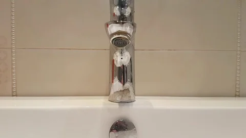 Water flows from the tap Stock Footage 87505956