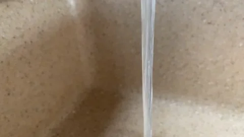 The water flows from a tap Stock Footage 140583375