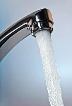 Water flows from a tap 写真素材