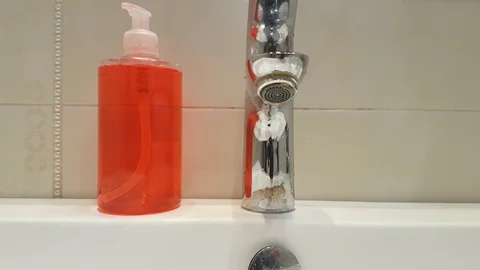 Water flows from the tap, saving Stock Footage 87505963