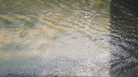 Water flows through concrete drainage ditches. Selective focus Stock Footage 125650142
