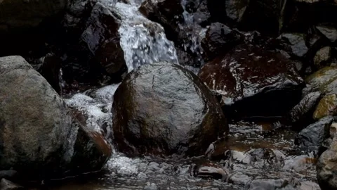 Water flows through mountain rocks Stock Footage 280379075