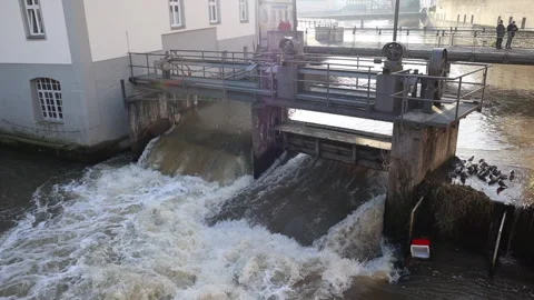 Water flows through open sluices Stock Footage 311928919