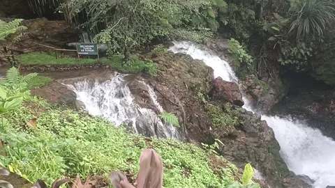 Water flows through the rocks, Ciater, April 4, 2025 Stock Footage 310558832