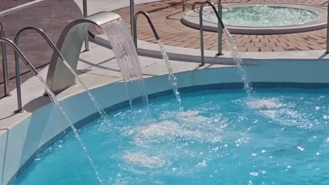 Water Flows Through The various metal pipes into Pool Stock Footage 248967112