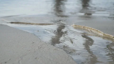 Water flows on a tropical beach of white sand - 2 Stock Footage 132399105