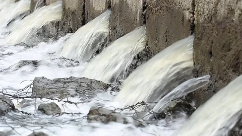 Water flows under pressure at hydroelectric dams. Stock Footage 76506906