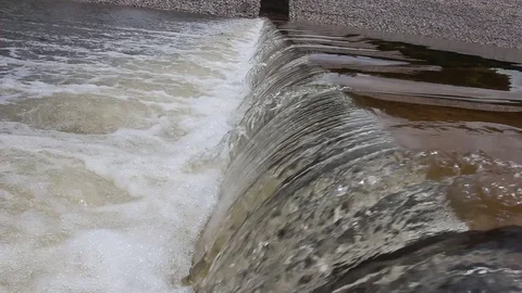 Water flows under pressure at hydroelectric dams. Stock Footage 76506907