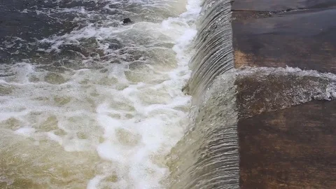 Water flows under pressure at hydroelectric dams. Stock Footage 76507302