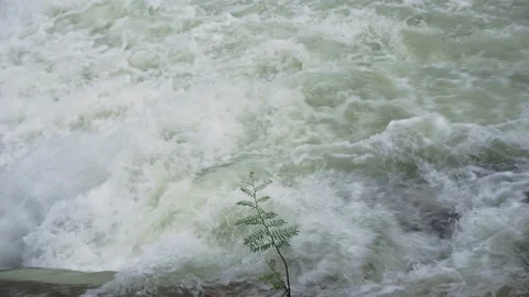 Water flows from the weir of a large dam. Stock Footage 147965490