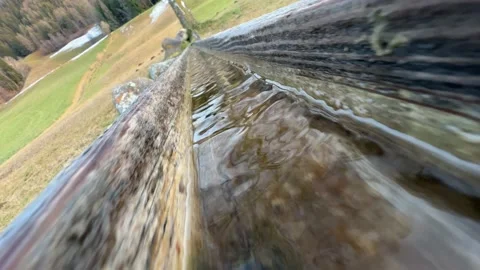 Water flows on the wooden path Video stock 232381741