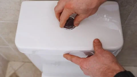 The water flush button is installed in the toilet barrel Video stock 312050201