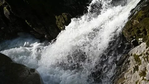 Water flushes between rocks of a mountain stream Stock-Footage 260822446