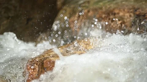 Water flushes over the stones of a mountain stream in summer (slow motion) Stock-Footage 219391353