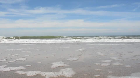 Water foaming at the beach Stock Footage 50426686