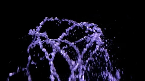 Water from fountain creating abstract pattern with light in the night Stock Footage 130151373
